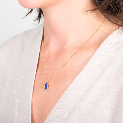 Petite tanzanite necklace side view