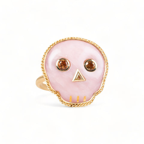 Pink opal skull ring with sapphire eyes