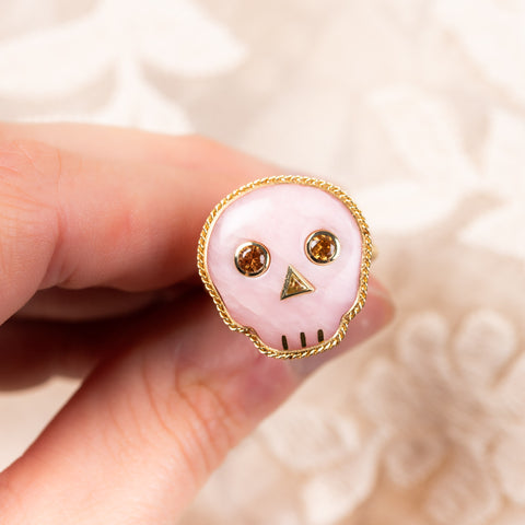 Pink opal skull ring displayed