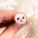 Pink opal skull ring displayed