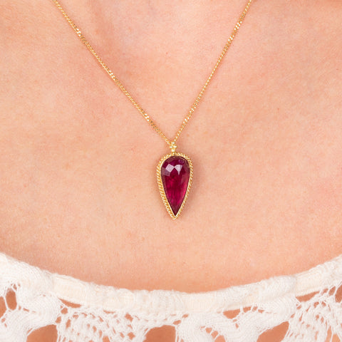 Ruby and gold necklace on model