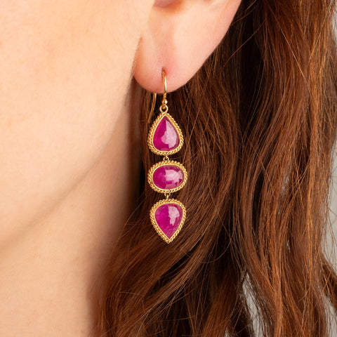 Ruby trio earrings on model