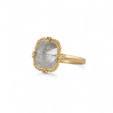 Side view of an 18k yellow gold and silver diamond ring.