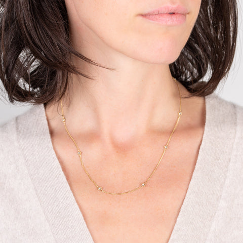 Textile necklace with gold and silver diamonds on a model