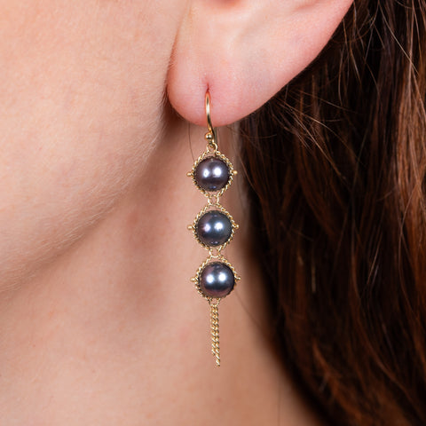 Grey akoya pearl earrings on model