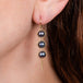Grey akoya pearl earrings on model