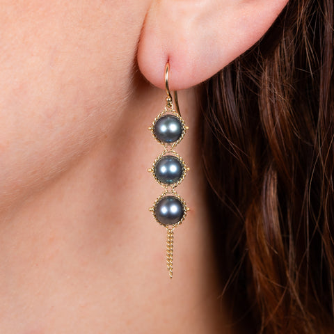 Blue akoya pearl earrings on model