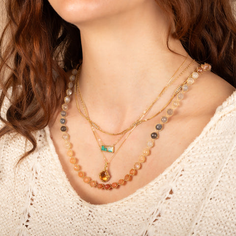 Moonstone textile necklace paired with turquoise and tourmaline necklaces