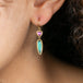 Tourmaline and sapphire earrings on model