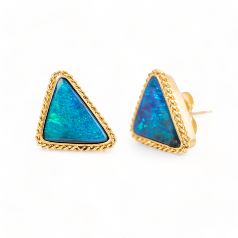 Boulder opal stud earrings in triangular shapes.