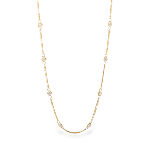 Close up of 18k gold whisper chain necklace with Pearl