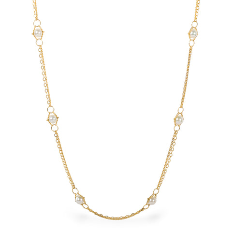 Close up of 18k gold whisper chain necklace with Pearl