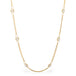 Close up of 18k gold whisper chain necklace with Pearl