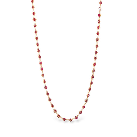Woven ruby necklace on white background