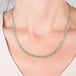 A model wears an 18k yellow gold and turquoise bead chain necklace.