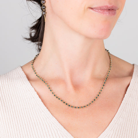 Woven blue diamond necklace on a model