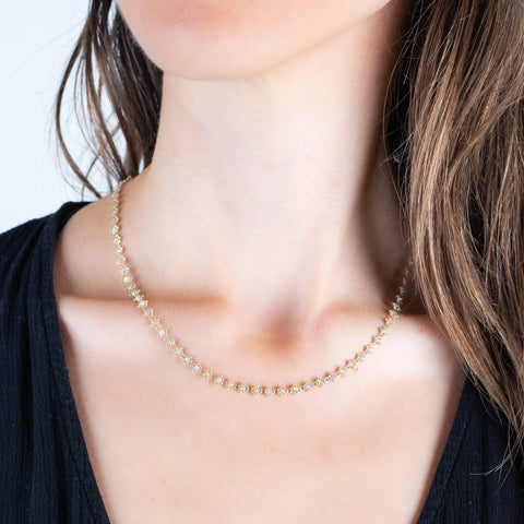 Woven silver diamond necklace on a model