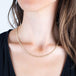 Woven silver diamond necklace on a model