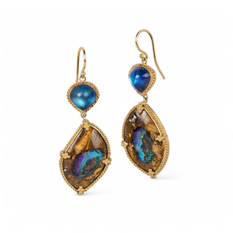 A pair of 18k yellow gold drop earrings featuring Yowah nut opals punctuated at the top by moonstones.