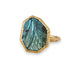 Labradorite ring in 18K yellow gold, showcasing an ornate pattern with mesmerizing hand-carved detail. The gemstone reveals a gradient wash from blue to green as light dances upon it. Encased in a handmade gold bezel. Handmade in New York.