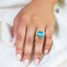 Labradorite ring in 18K yellow gold with luminescence, reminiscent of moonbeams. Handmade bezel encases the gem in 18k yellow gold with a braided detail and granulated prongs.