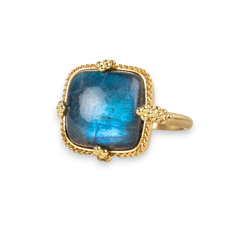 Labradorite ring in 18K yellow gold with luminescence, reminiscent of moonbeams. Handmade bezel encases the gem in 18k yellow gold with a braided detail and granulated prongs.