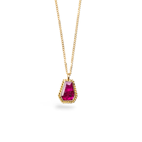 Geometric Ruby pendant on an 18K yellow gold chain. Set in a handmade gold bezel with braided detail. Handmade in New York.