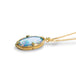 An oval Ethiopian opal pendant on an 18k yellow gold chain