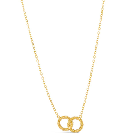 Two 18k yellow gold circles are crafted with diamond cut chain and hang interlocking on a delicate chain.