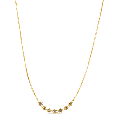 This delicate 18k yellow gold necklace features a row of seven woven grey diamond beads in the center. The necklace is finished with a lobster clasp closure