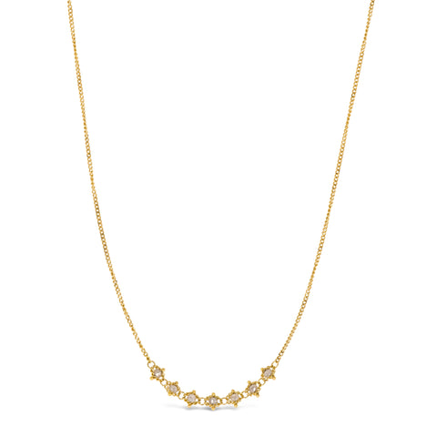 This delicate 18k yellow gold necklace features a row of seven woven silver diamond beads in the center. The necklace is finished with a lobster clasp closure