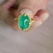 A video of a handmade 18k yellow gold and emerald gemstone ring.