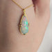 A video of an ethiopian opal and 18k gold necklace