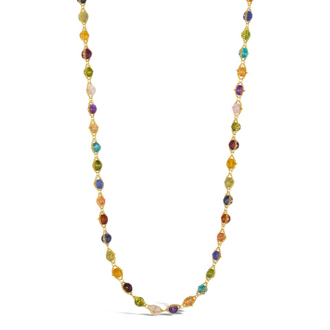 A long multi-colored stone necklace is woven with 18k yellow gold chains. The necklace features gemstones including Sunstone, Peridot, Aquamarine, Lolite, Apatite, Imperial Topaz, Rhodolite Garnet, Morganite, Tanzanite, Amethyst, and Grossular Garnet. Available in 24" and 34" variations.