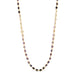 A woven 18k yellow gold necklace features ombre shaded faceted amethyst beads throughout