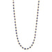 A long 18k yellow gold necklace is woven together with tanzanite beads throughout.