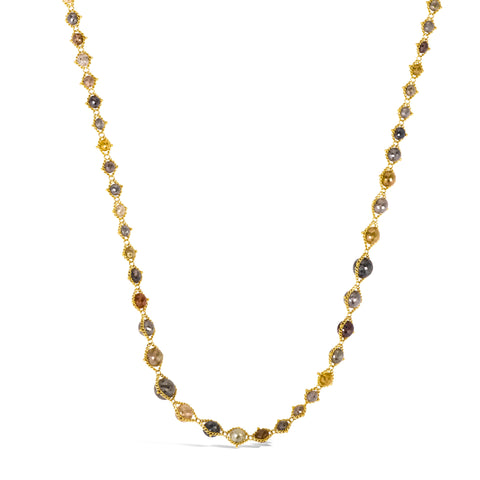 Handcrafted necklace featuring multi-colored diamonds strung in 18k yellow gold chain that increase in size and then decrease along the necklace.