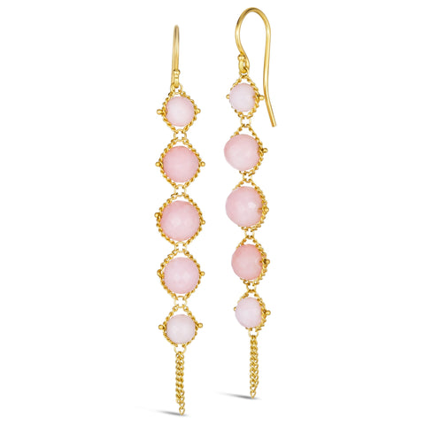 A pair of long 18k yellow gold earrings are crafted with graduated pink opals suspended in delicate chain. The earrings are fastened with French hook closures.