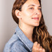 A model wears a long graduated labradorite stone earring suspended in 18k yellow gold chain.