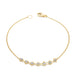 This delicate 18k yellow gold chain bracelet features a row of woven silver diamonds in the center and closes with a lobster clasp.