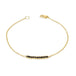 This delicate 18k yellow gold chain bracelet features a row of woven black diamonds in the center and closes with a lobster clasp.