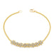 This delicate 18k yellow gold chain bracelet features three rows of woven silver diamonds in the center. The bracelet is finished with a lobster clasp closure.