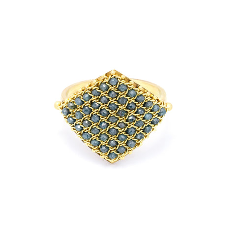 This 18k yellow gold ring is crafted with blue diamond beads woven into a diamond shaped lattice pattern.