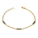 This 18k yellow gold chain bracelet features three blue diamond bars stationed throughout. The bracelet is finished with a lobster clasp.