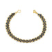 This 18k yellow gold chain bracelet features three rows of woven black diamonds. The bracelet is finished with a lobster clasp closure.