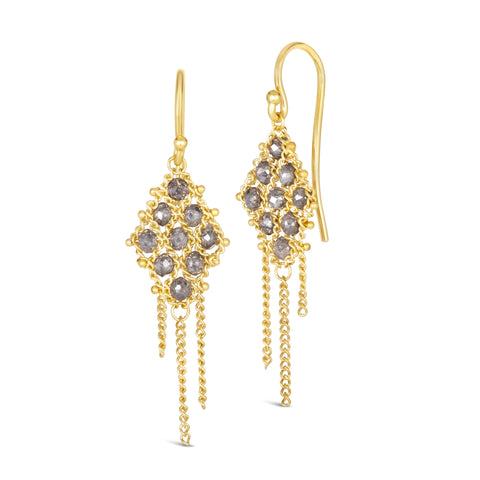 Small grey diamonds are woven with 18k yellow gold chain in a diamond lattice pattern and have three dangling chains. The earrings are fastened with french hook closures.