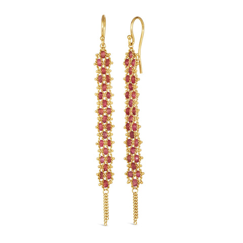 A pair of long red spinel earrings features a woven lattice pattern and two dangling chains at the bottom of the earring. The earrings fasten with french hook closures.