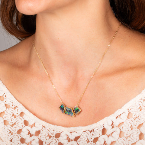 Boulder opal necklace on model