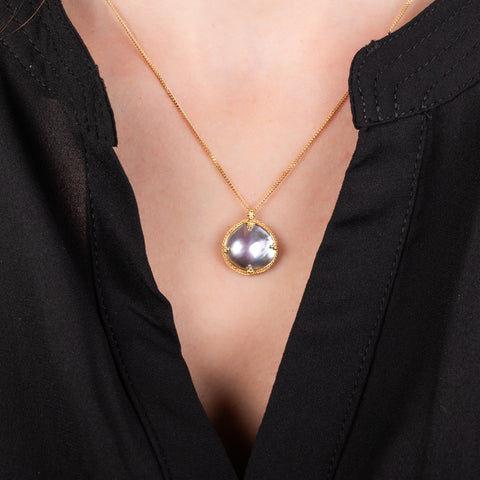 Abstract mabe pearl necklace on model
