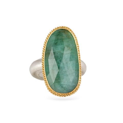 Handmade emerald ring with a gold bezel and sterling silver band